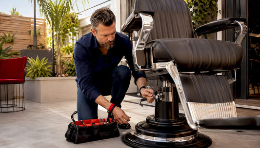 Barbershop owner inspecting hydraulic barber chair
