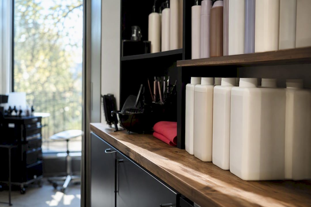 Shelves storing hair colour safely in salon